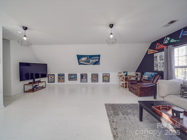 living room with lofted ceiling and visible vents