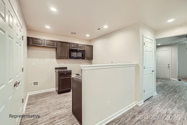 kitchen featuring ceiling fan, light hardwood / wood-style flooring, and dark brown cabinetry