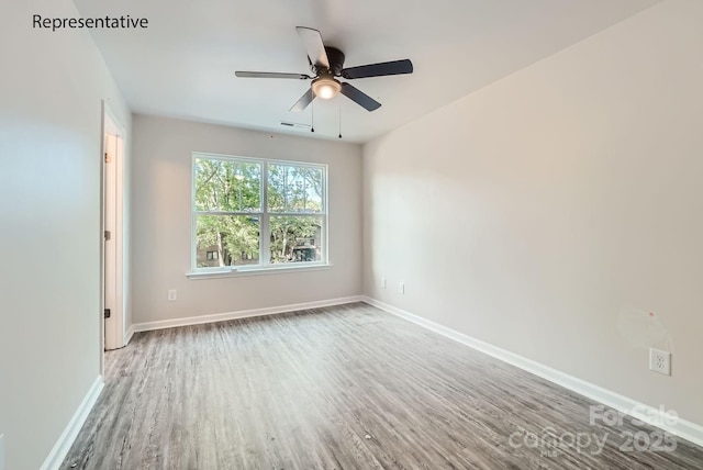 spare room featuring ceiling fan and wood-type flooring