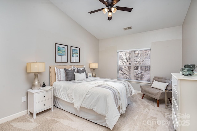 bedroom with light colored carpet, visible vents, vaulted ceiling, and baseboards