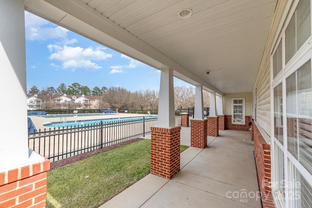 view of patio / terrace featuring a community pool