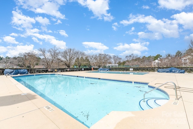 community pool with a patio