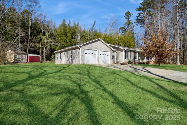 exterior space with a garage, a front lawn, and a shed