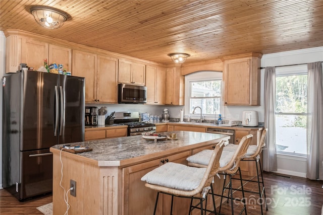 kitchen with wood ceiling, appliances with stainless steel finishes, a center island, dark wood-type flooring, and sink