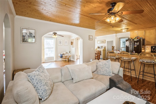 living room featuring ceiling fan, wood ceiling, and hardwood / wood-style floors