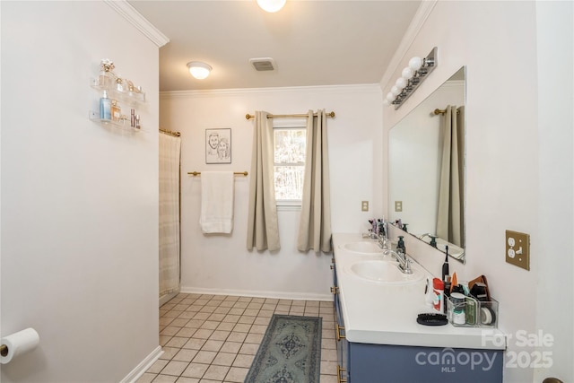 bathroom with tile patterned floors, vanity, and crown molding