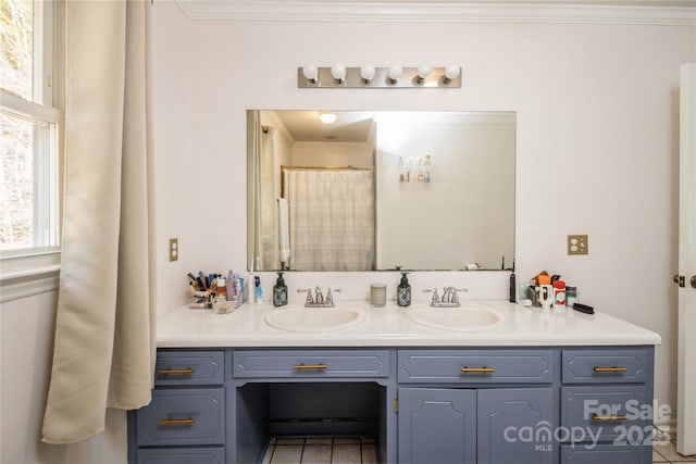 bathroom with curtained shower, vanity, crown molding, and tile patterned flooring