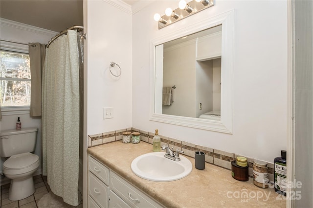 bathroom featuring toilet, tile patterned flooring, crown molding, and vanity