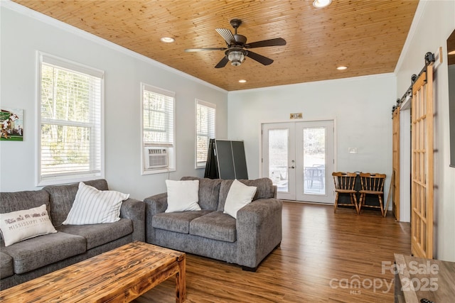 living room with wooden ceiling, crown molding, french doors, and a barn door