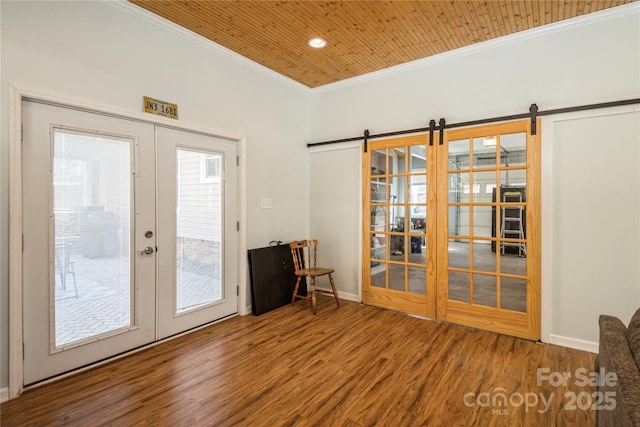 doorway to outside with a barn door and french doors