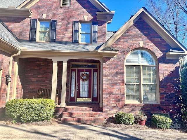 property entrance with covered porch