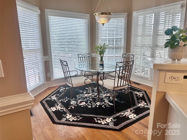 dining area with wood-type flooring