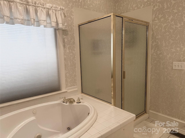 bathroom with tile patterned floors and separate shower and tub