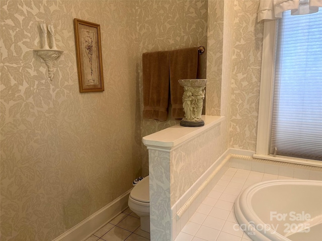 bathroom with tile patterned floors and toilet