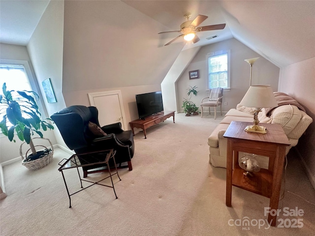 living room featuring light carpet, ceiling fan, and lofted ceiling