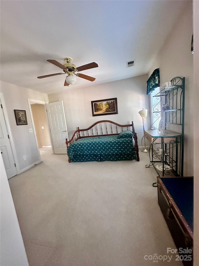 bedroom with ceiling fan and carpet