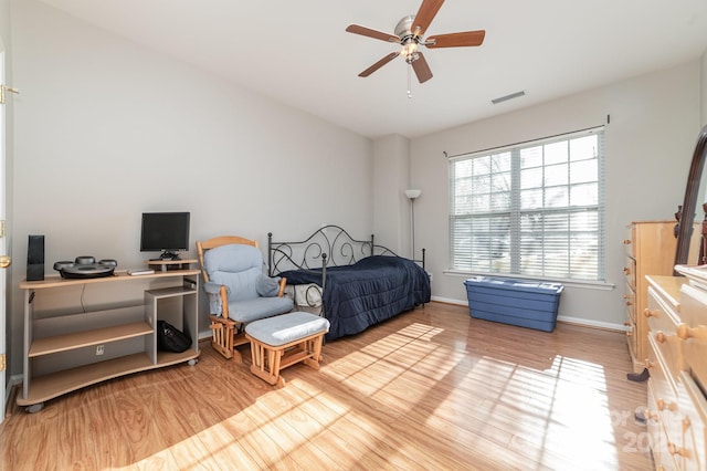 bedroom with light hardwood / wood-style flooring and ceiling fan