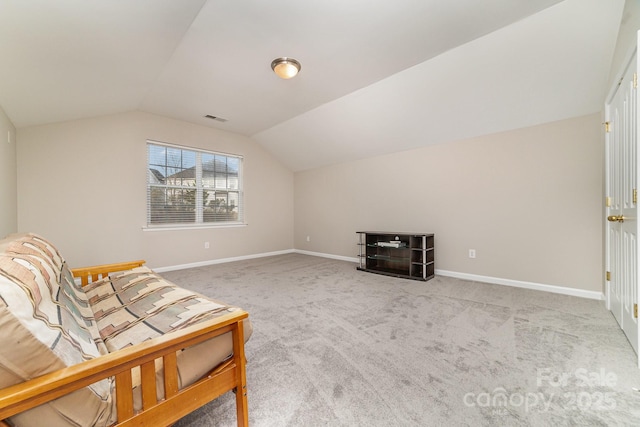 living area with carpet floors and lofted ceiling