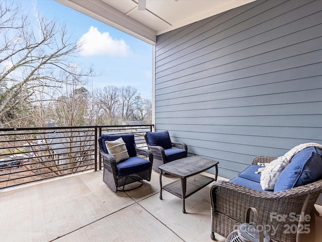 view of patio featuring a balcony and ceiling fan