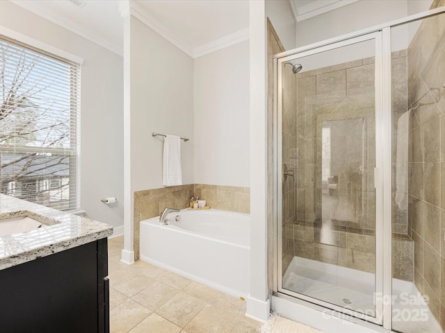 bathroom with ornamental molding, tile patterned flooring, and vanity