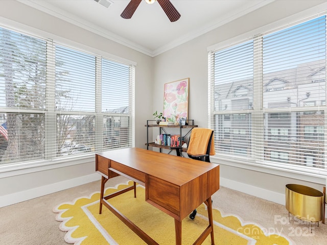 office featuring ornamental molding, a wealth of natural light, light carpet, and ceiling fan