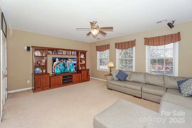 living room featuring ceiling fan and light carpet