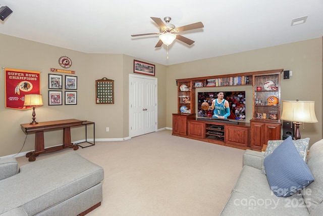 living room with ceiling fan and light colored carpet