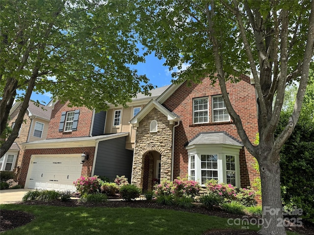 626 Lorain Ave NW, Concord, NC 28027 - view of front facade with an attached garage, stone siding, brick siding, a front yard, and driveway
