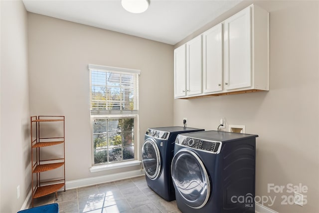 laundry room with cabinets, plenty of natural light, and independent washer and dryer