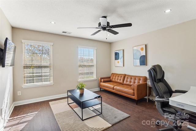 office area featuring ceiling fan and dark wood-type flooring