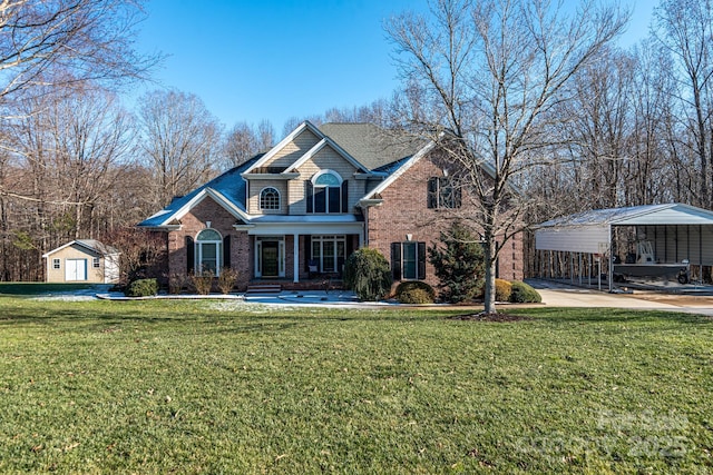 view of front property with a front yard, a carport, and an outdoor structure