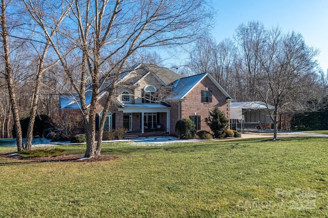 front of property featuring a carport and a front yard