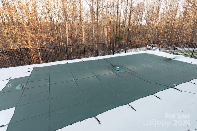 view of snow covered pool