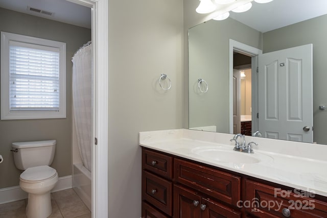 full bathroom with tile patterned flooring, shower / tub combo, vanity, and toilet