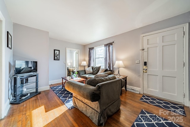 living room featuring dark wood-type flooring