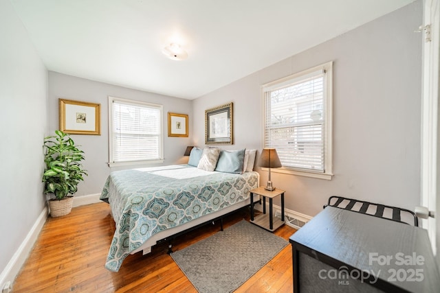 bedroom with wood-type flooring