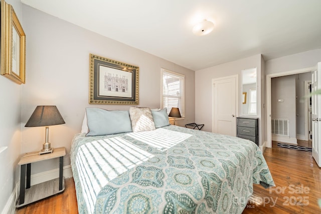 bedroom featuring hardwood / wood-style flooring