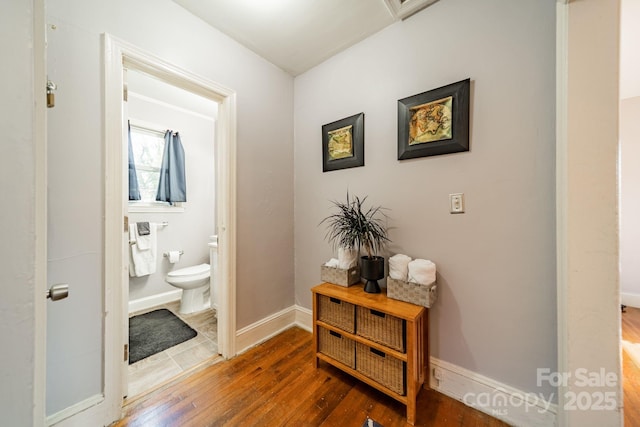 hallway featuring dark hardwood / wood-style flooring