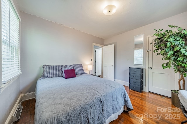 bedroom with wood-type flooring