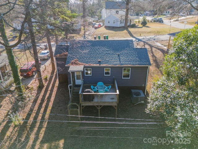 back of property with cooling unit and a deck