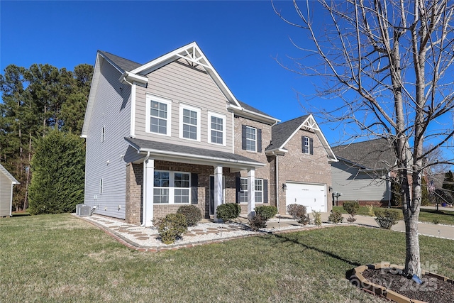 view of front of house with a garage, a front lawn, and central air condition unit