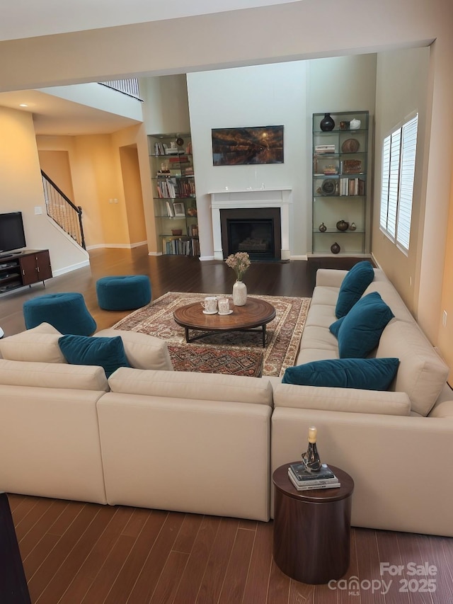 living room featuring dark hardwood / wood-style flooring