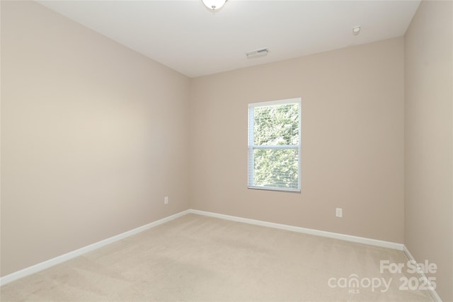 empty room featuring light colored carpet