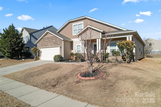 view of front of property featuring a garage and a front yard