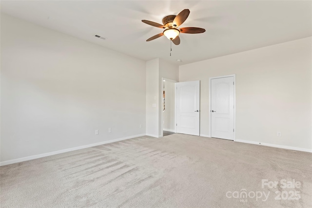 unfurnished bedroom with ceiling fan and light carpet