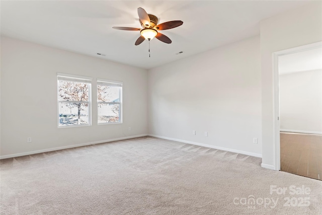 spare room with light carpet and ceiling fan