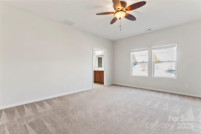 empty room featuring light carpet and ceiling fan