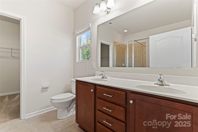 bathroom with vanity, toilet, an enclosed shower, and tile patterned flooring