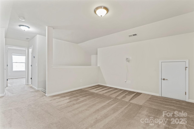 bonus room featuring light colored carpet and vaulted ceiling