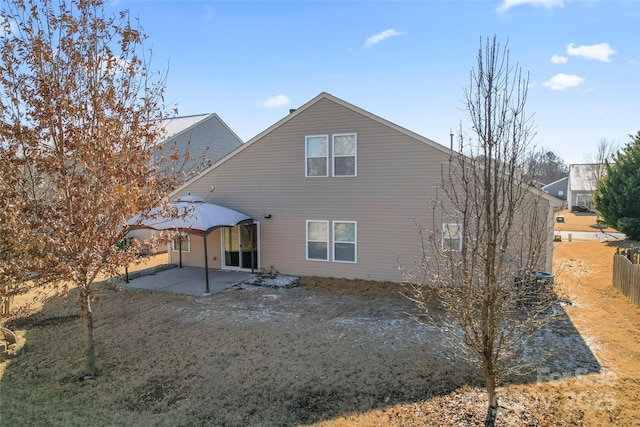 rear view of property featuring a patio